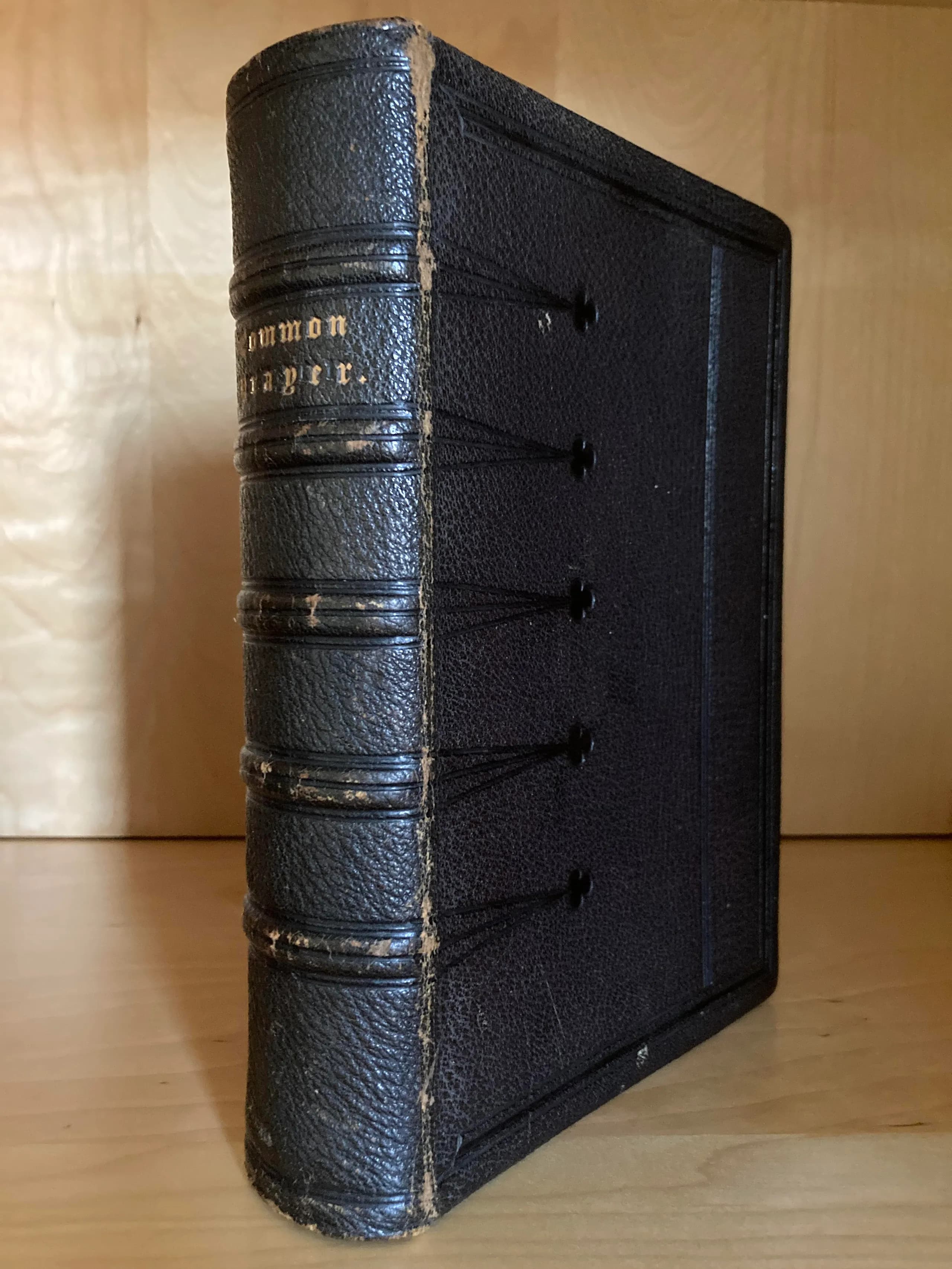A reverent book-detail of a leather prayer book
